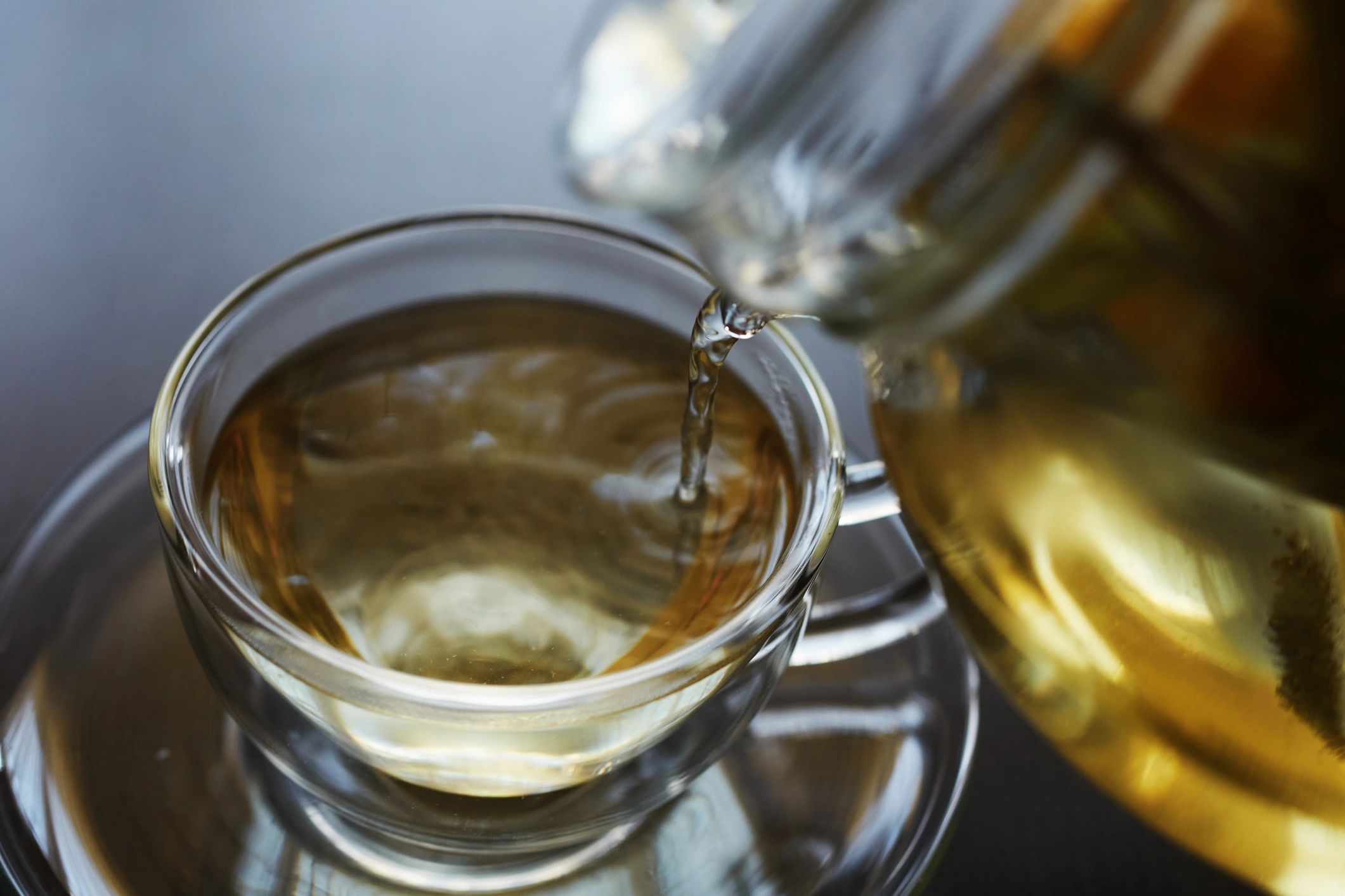 Herbal tea with lemon and herbs in a warm setting