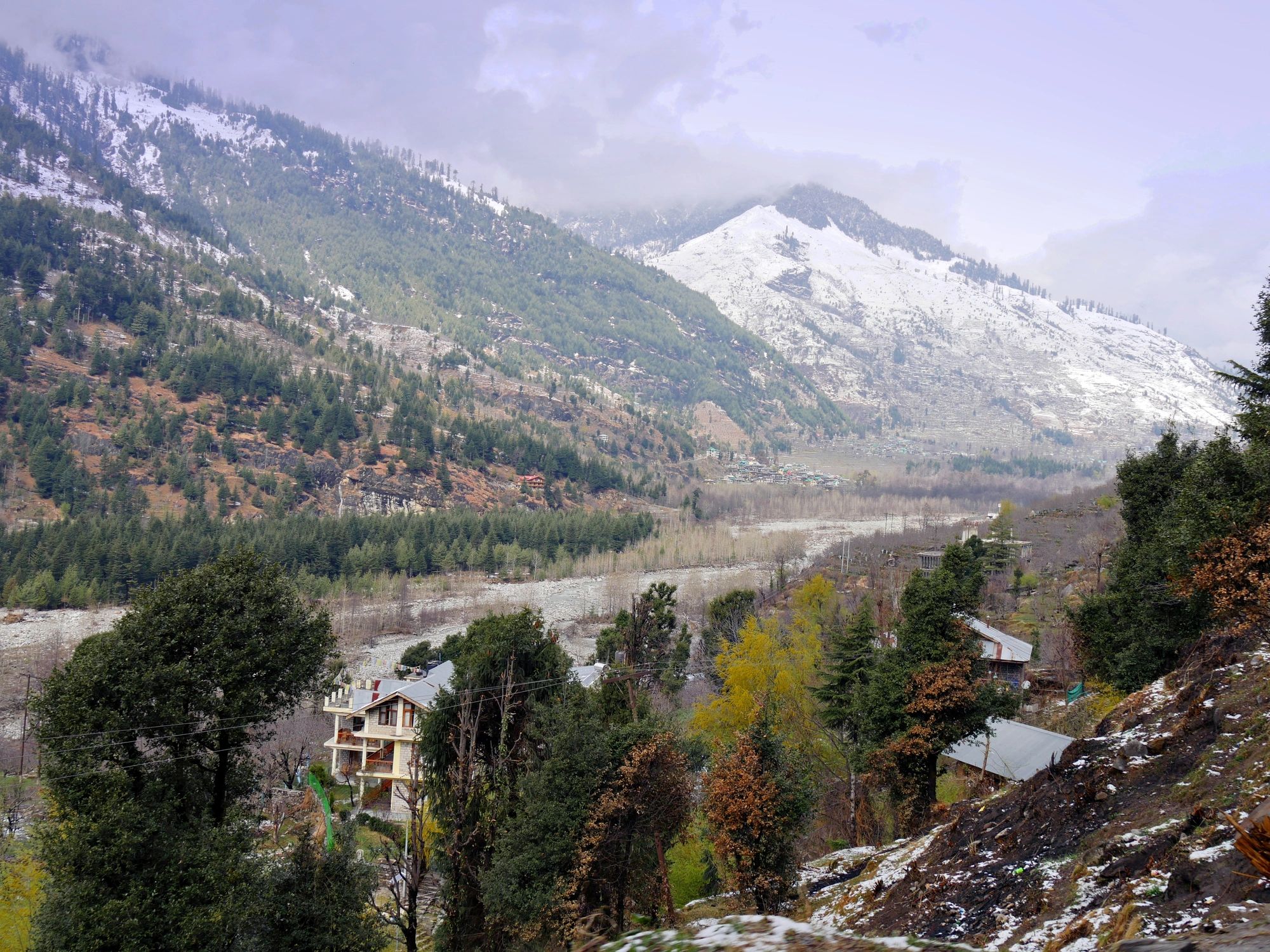 Snow-capped mountains above a river valley