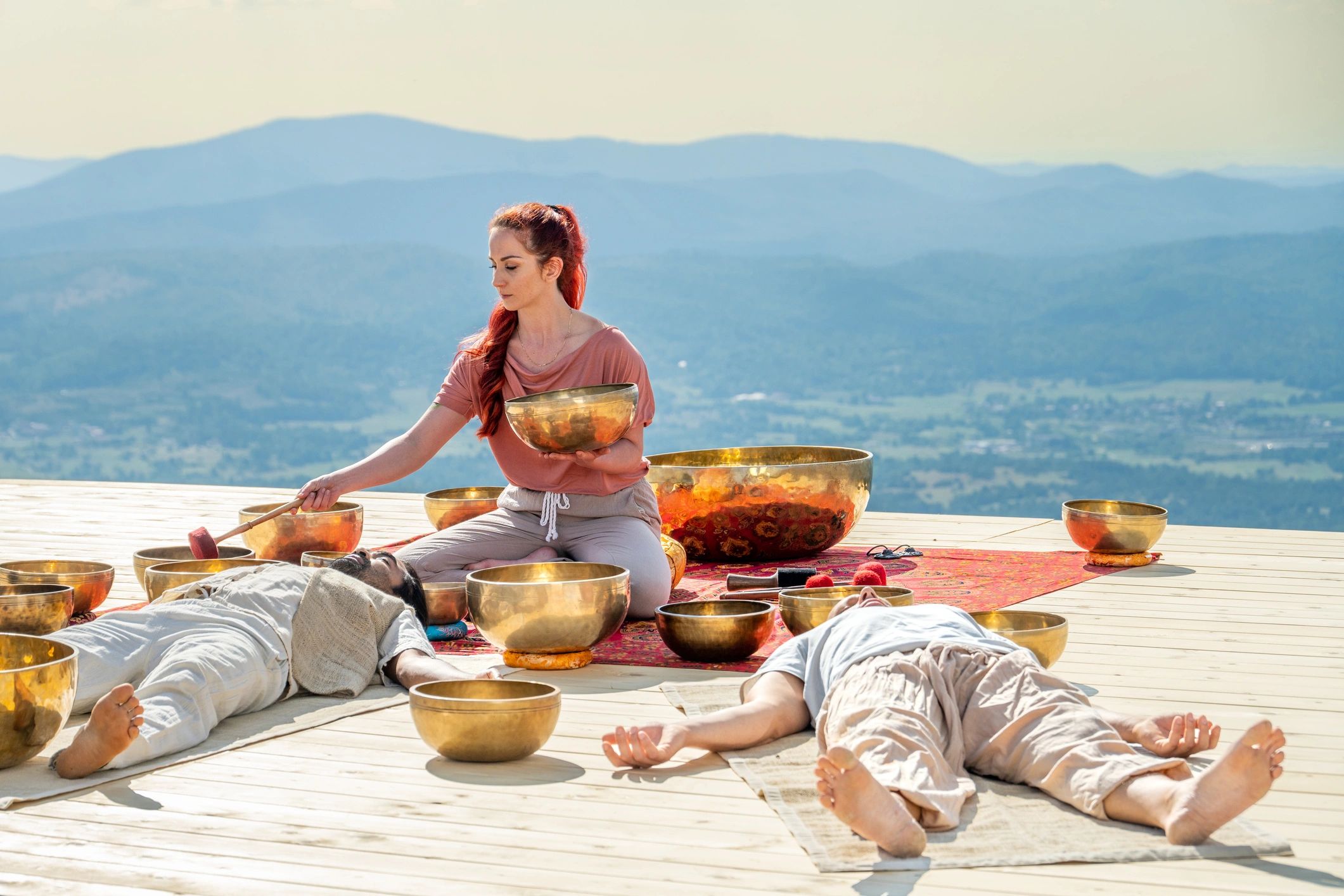 Singing bowls used in meditation with mountains in the background