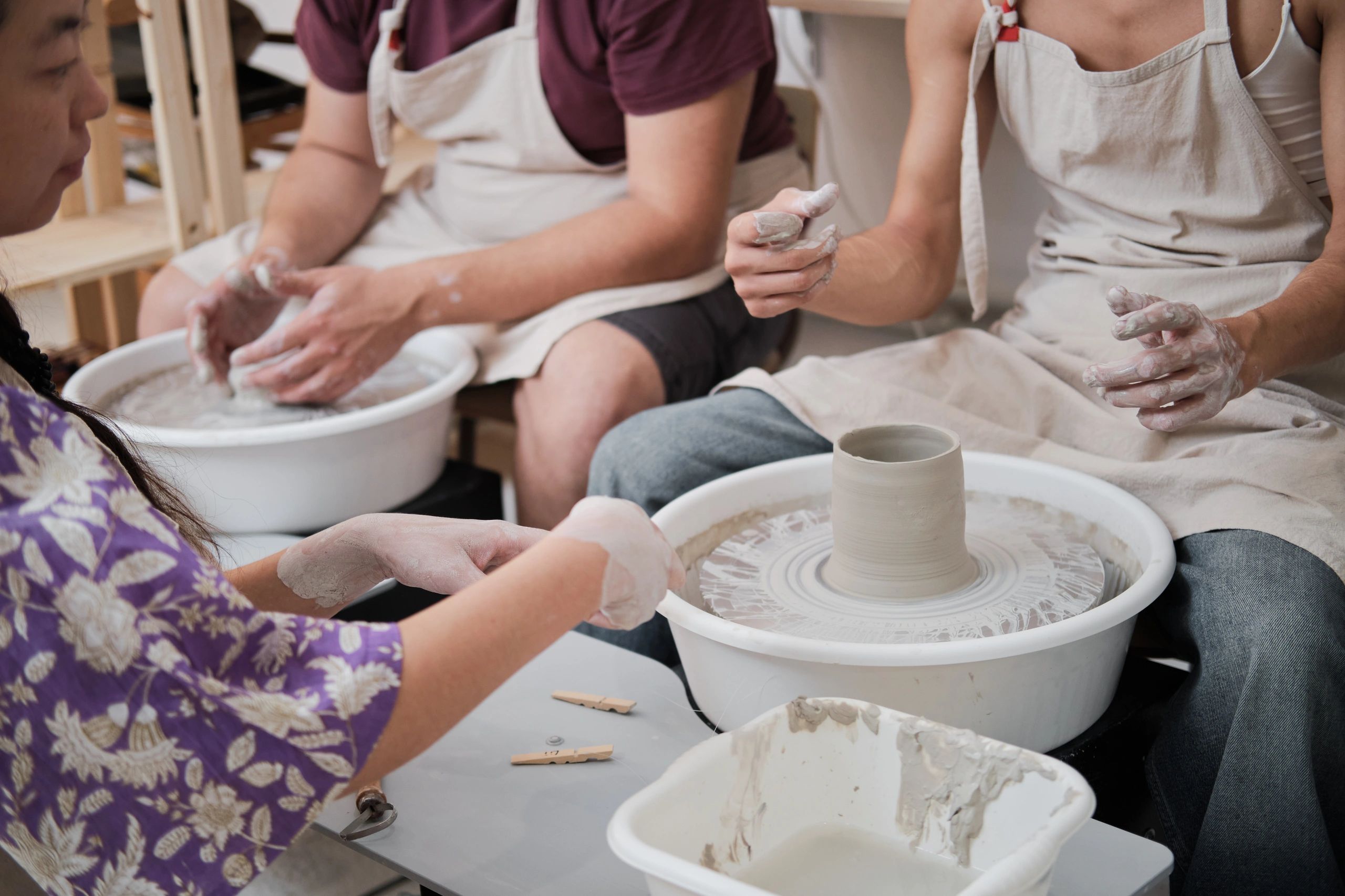 Ceramic class focused on shaping pottery