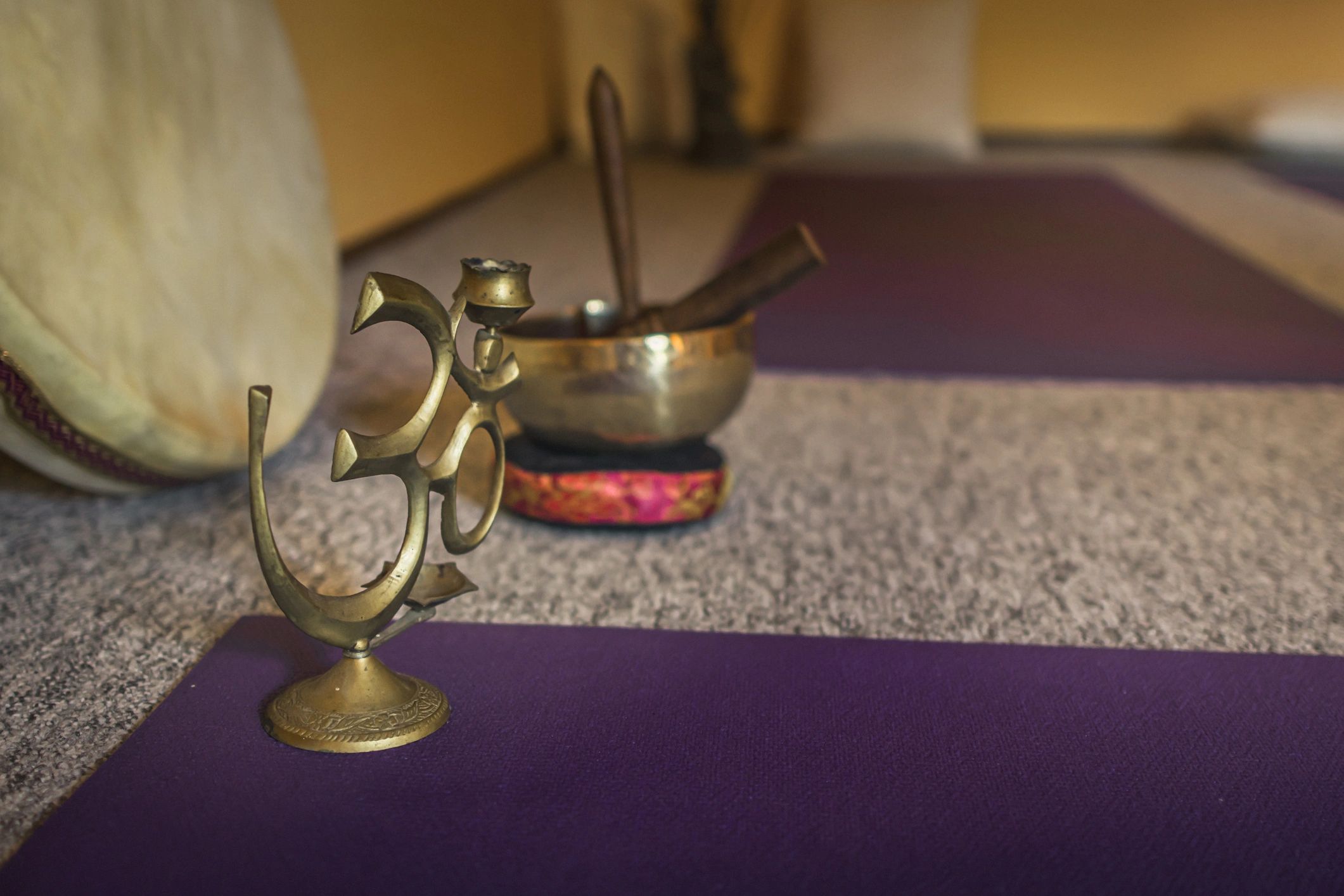 Tibetan singing bowl and meditation instruments arranged for a sound healing session