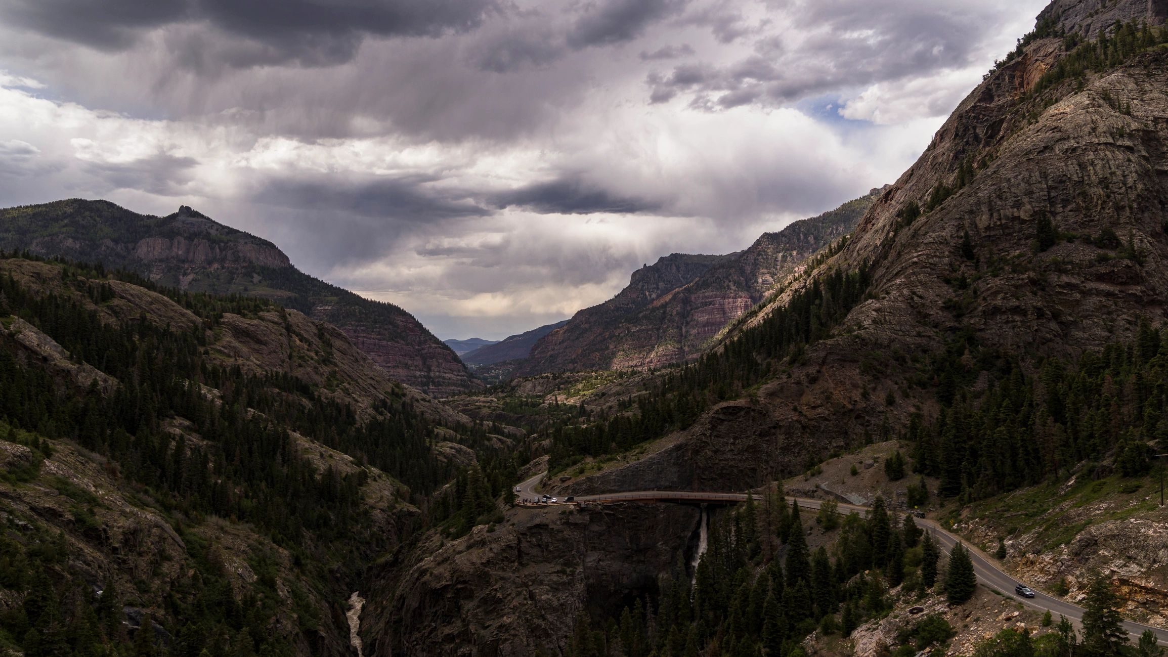 Mountain road and waterfall landscape