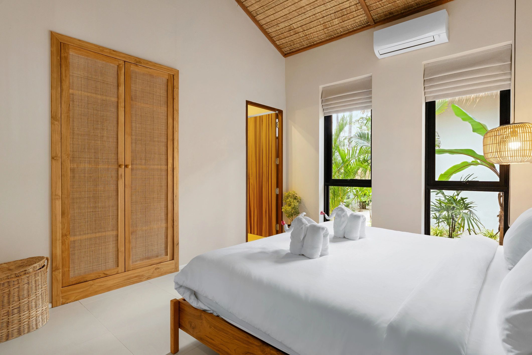 Minimal, comfortable bedroom with natural light